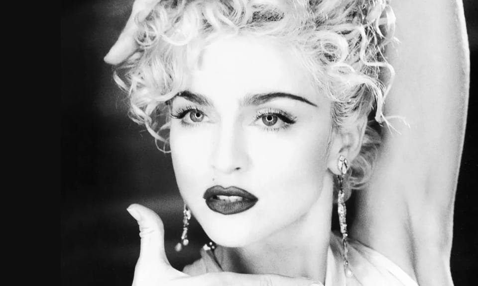 Madonna striking a pose in the "Vogue" video.